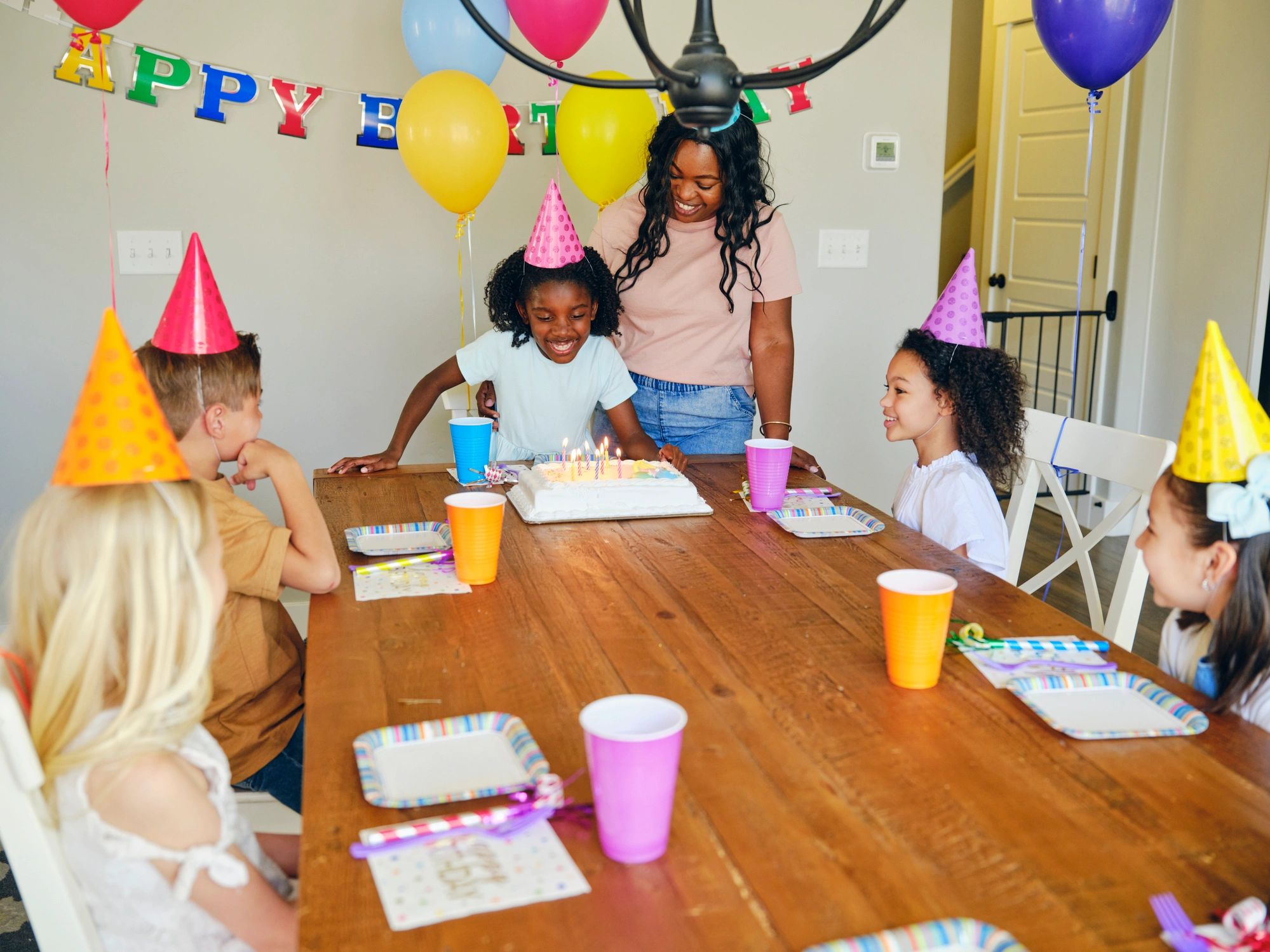 Children enjoying a birthday party at home